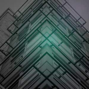 Upward view of a building corner in converging steel and glass, lit teal at the apex