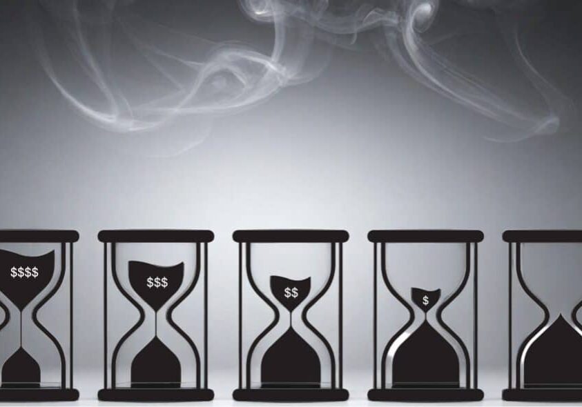 smoke in sky with hourglasses slowly declining revenue