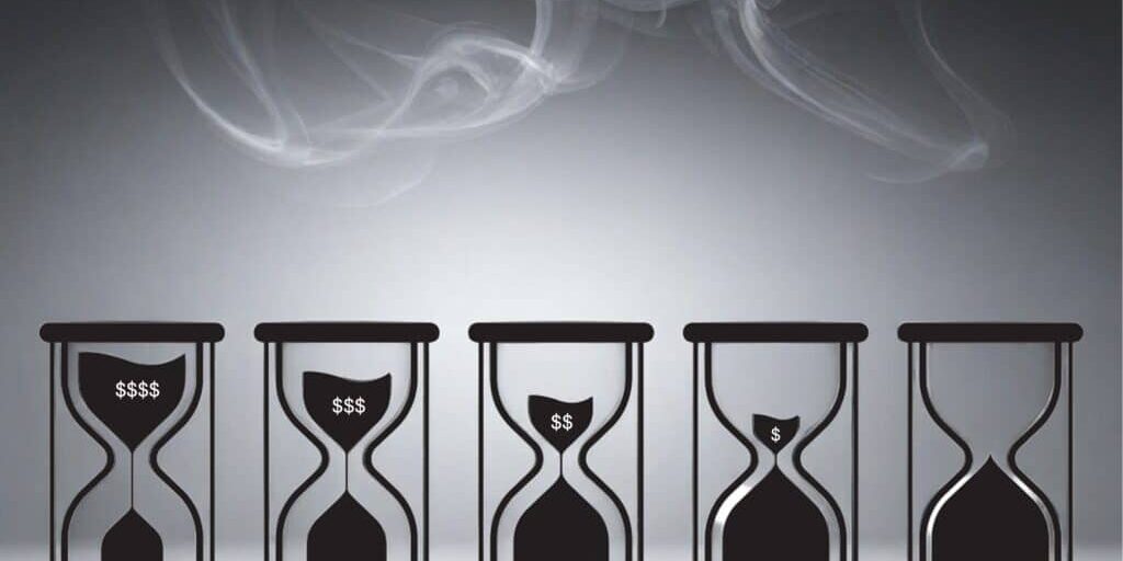 smoke in sky with hourglasses slowly declining revenue